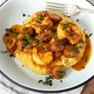 CAJUN SHRIMP AND GRITS WITH ANDOUILLE CREAM SAUCE